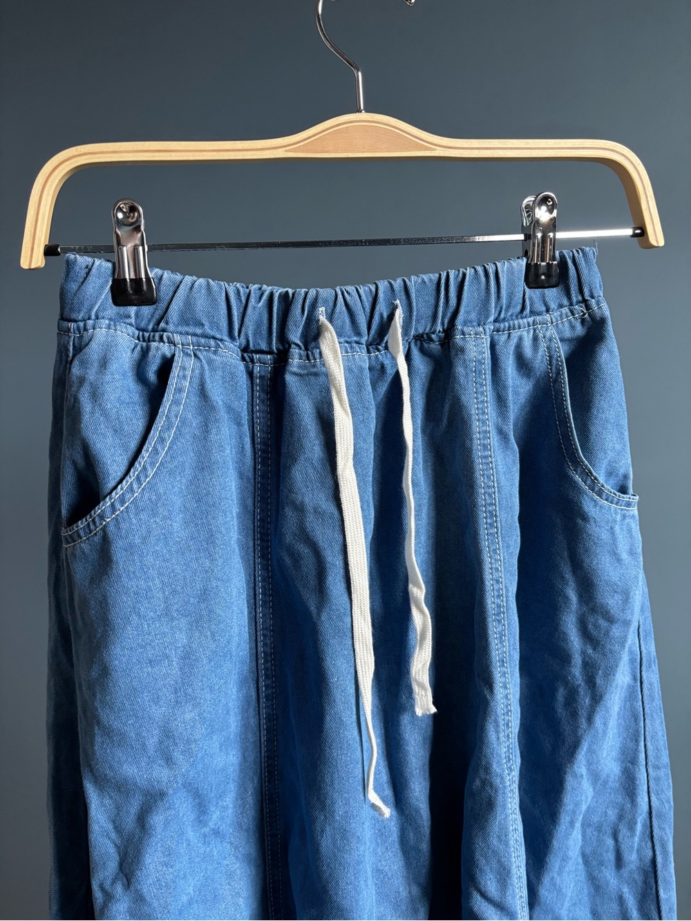 Blue denim maxi skirt with pockets and drawstring waist